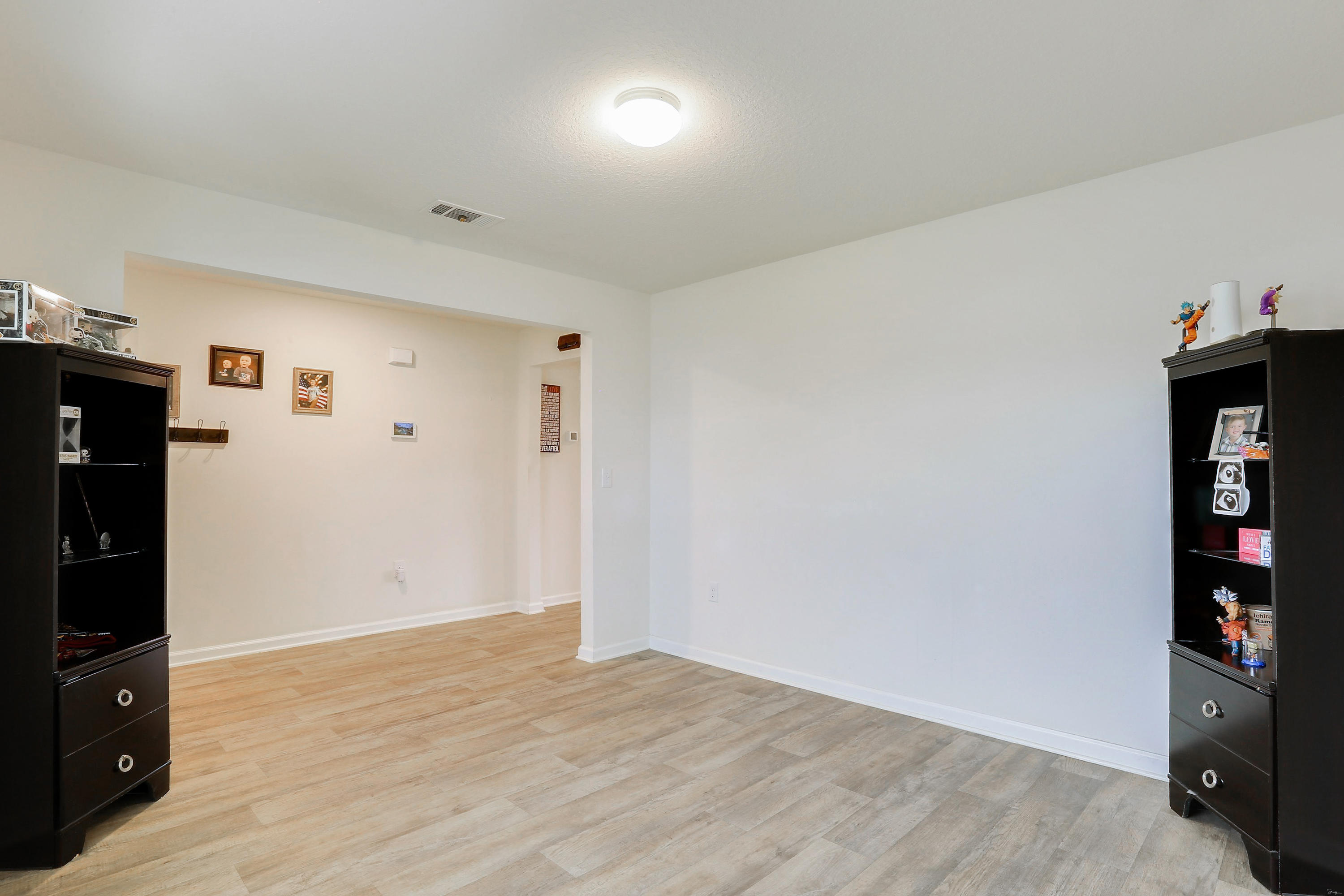 931 Merganser Way Crestview, FL 32539 - Photo 8 of 39 wooden floor in an empty room