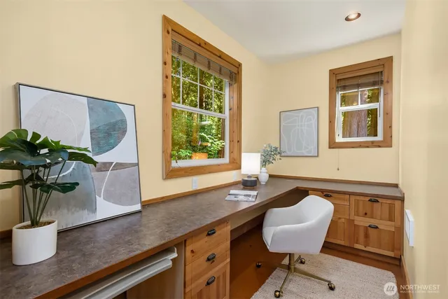 a view of a kitchen with a sink and a potted plant