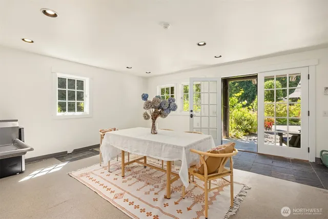 a view of a dining room with furniture window and outside view