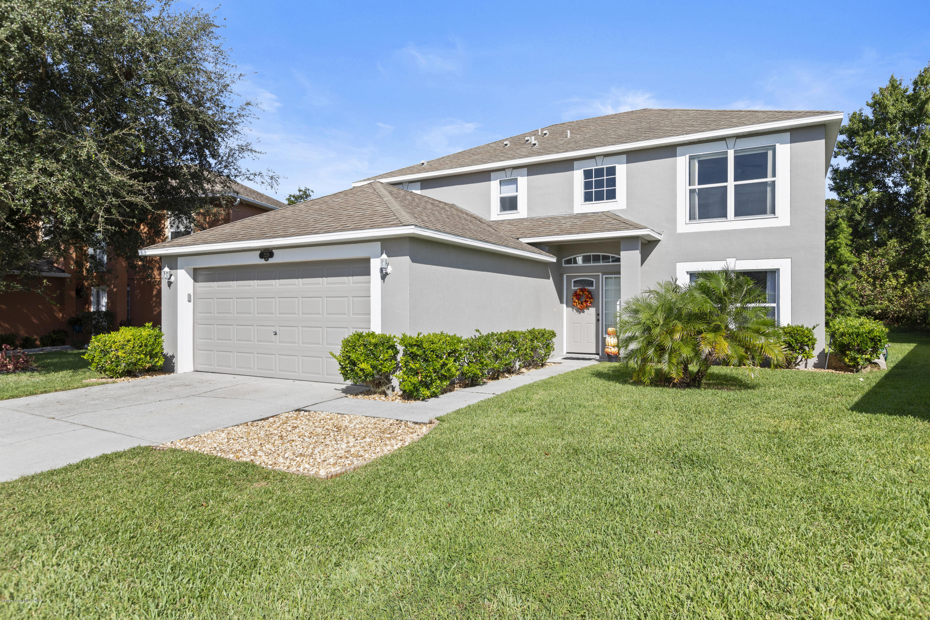2228 Spring Creek Circle Palm Bay, FL 32905 - Photo 1 of 41 Front of house