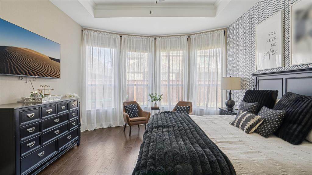 11192 Progreso Street Frisco, TX 75035 - Photo 14 of 30 a bedroom with a bed and a couch