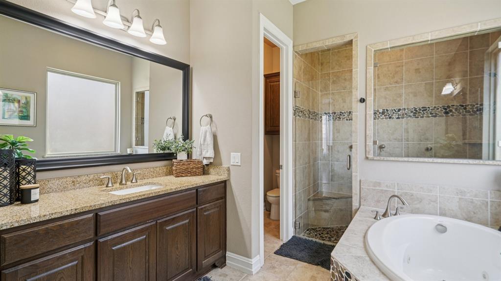 11192 Progreso Street Frisco, TX 75035 - Photo 16 of 30 a bathroom with a sink and a mirror