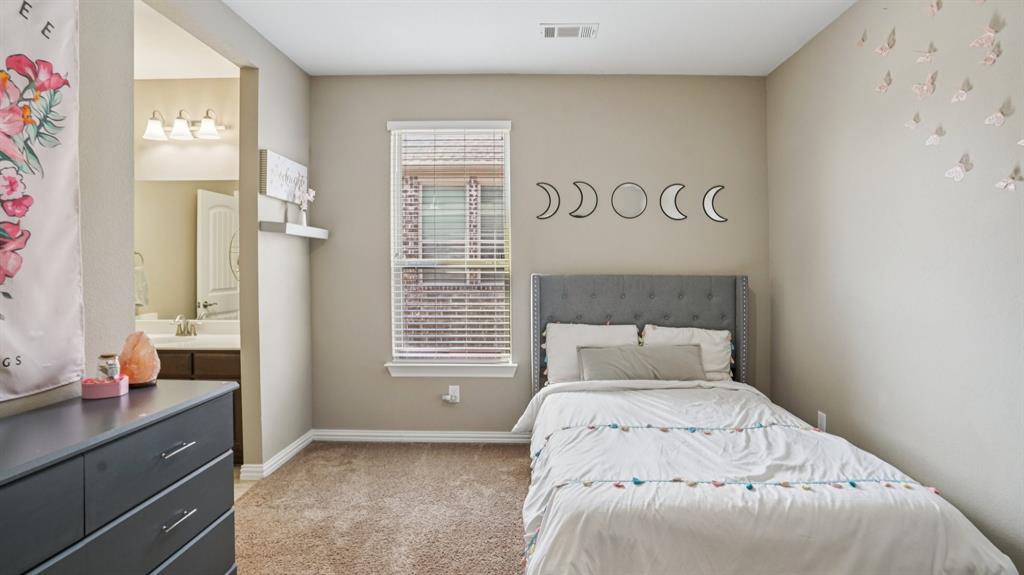 11192 Progreso Street Frisco, TX 75035 - Photo 23 of 30 a bedroom with a bed and a window