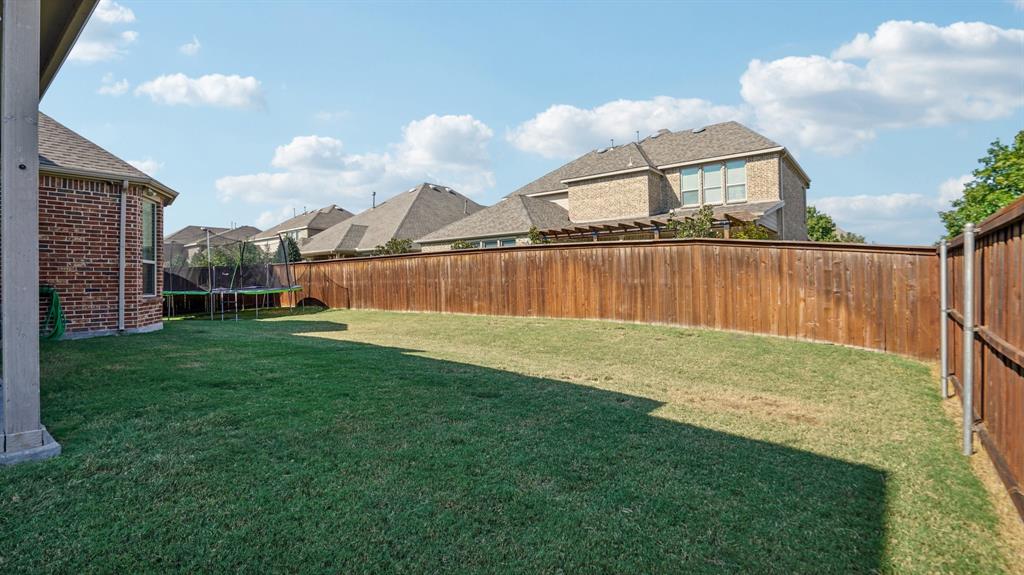 11192 Progreso Street Frisco, TX 75035 - Photo 29 of 30 a view of a lake and a yard
