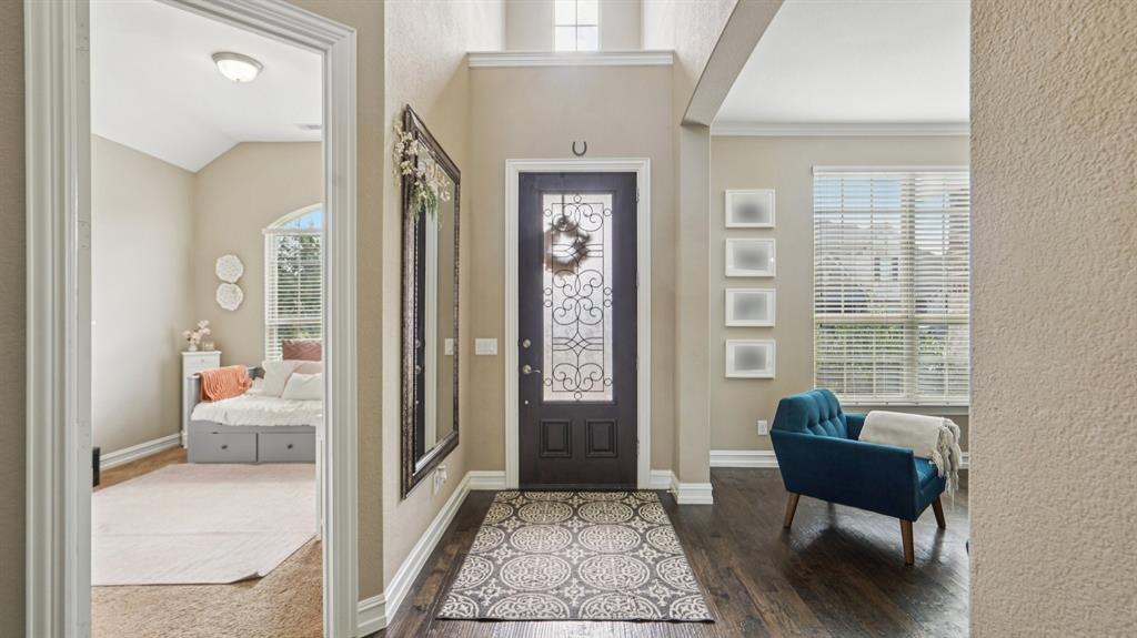 11192 Progreso Street Frisco, TX 75035 - Photo 3 of 30 a living room with furniture and a gate