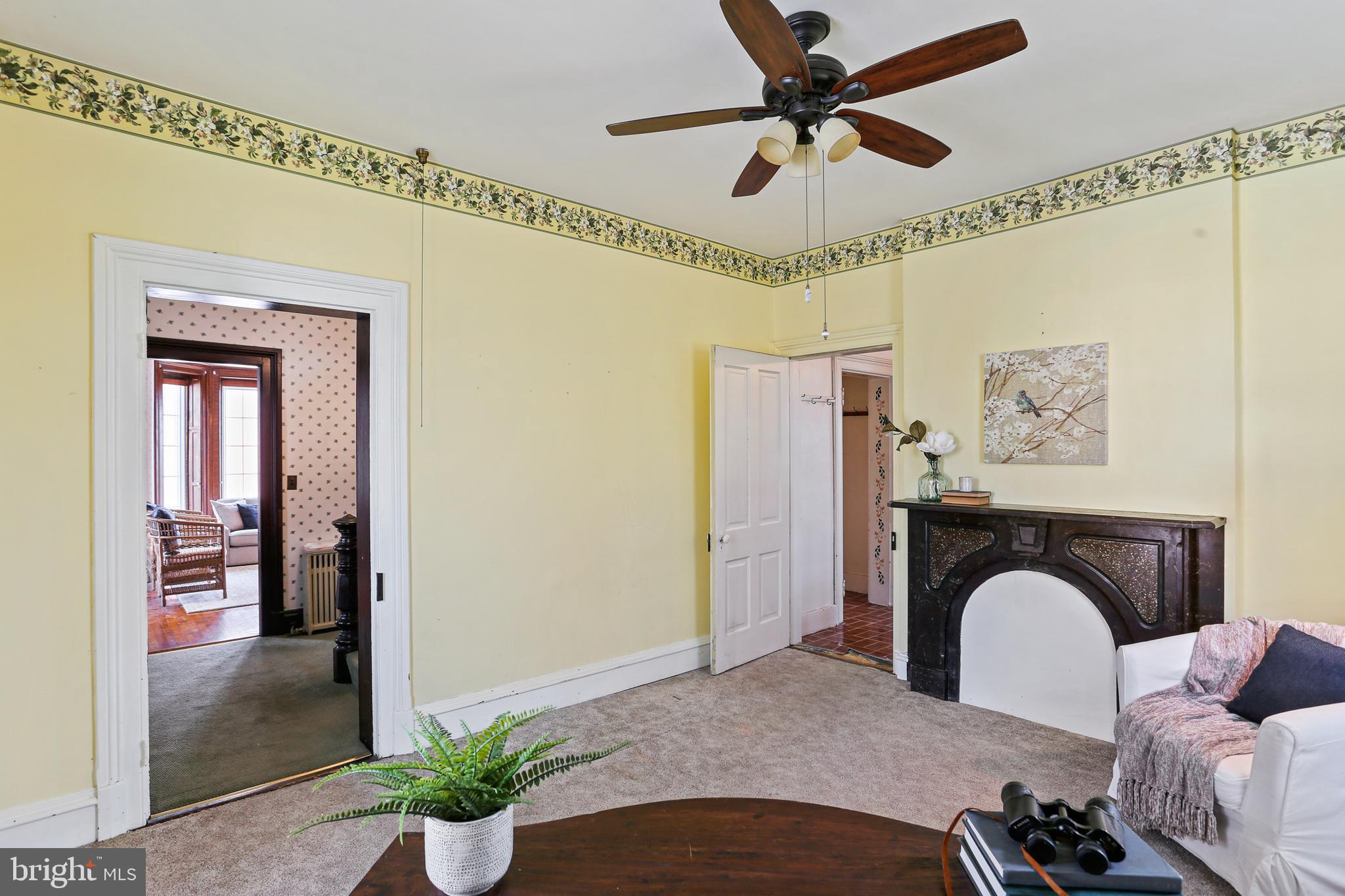 33 West Broadway Street Union Bridge, MD 21791 - Photo 7 of 31 a bedroom with a bed and a chandelier