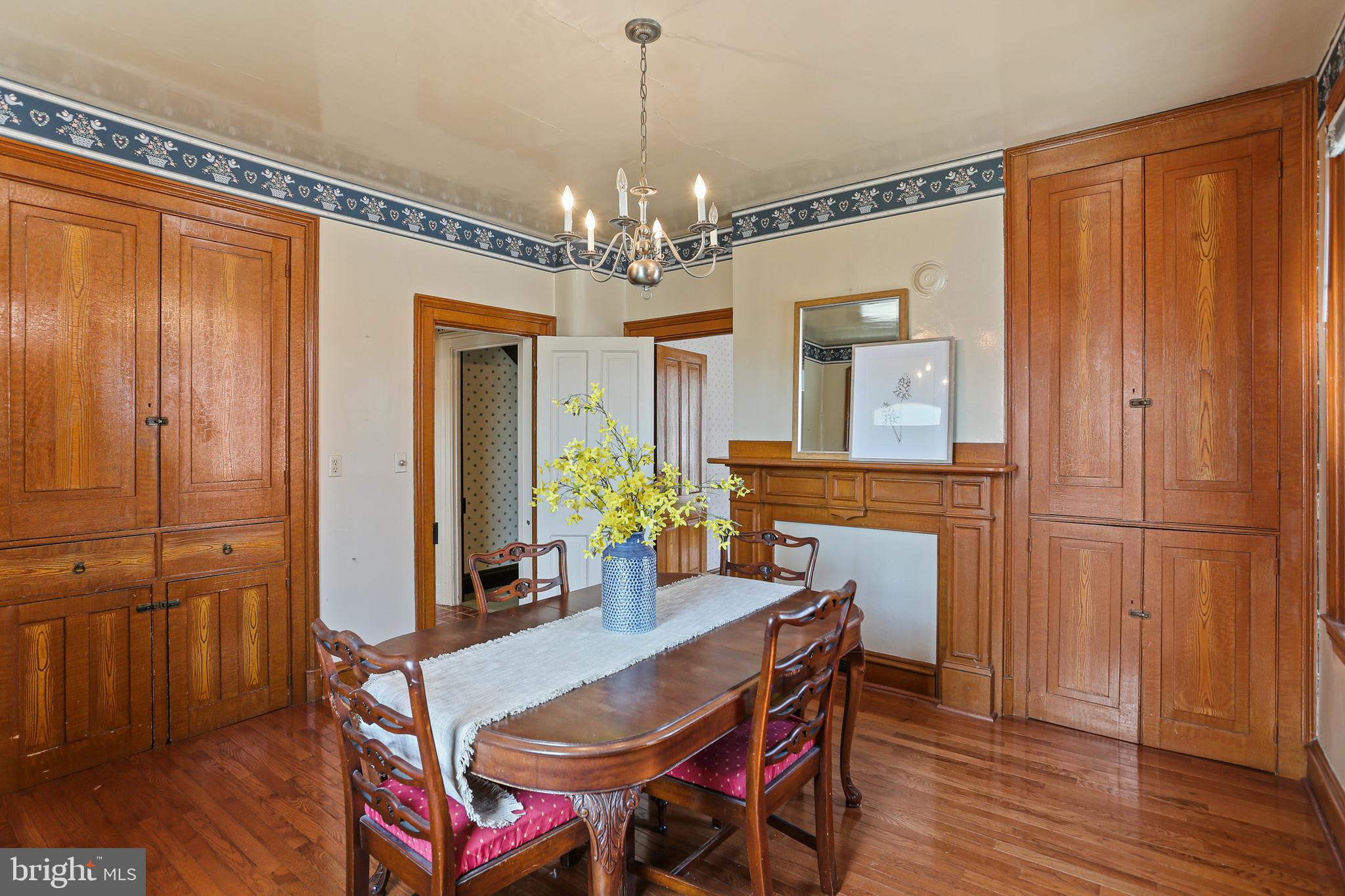 33 West Broadway Street Union Bridge, MD 21791 - Photo 9 of 31 a dining room with furniture a chandelier and wooden floor