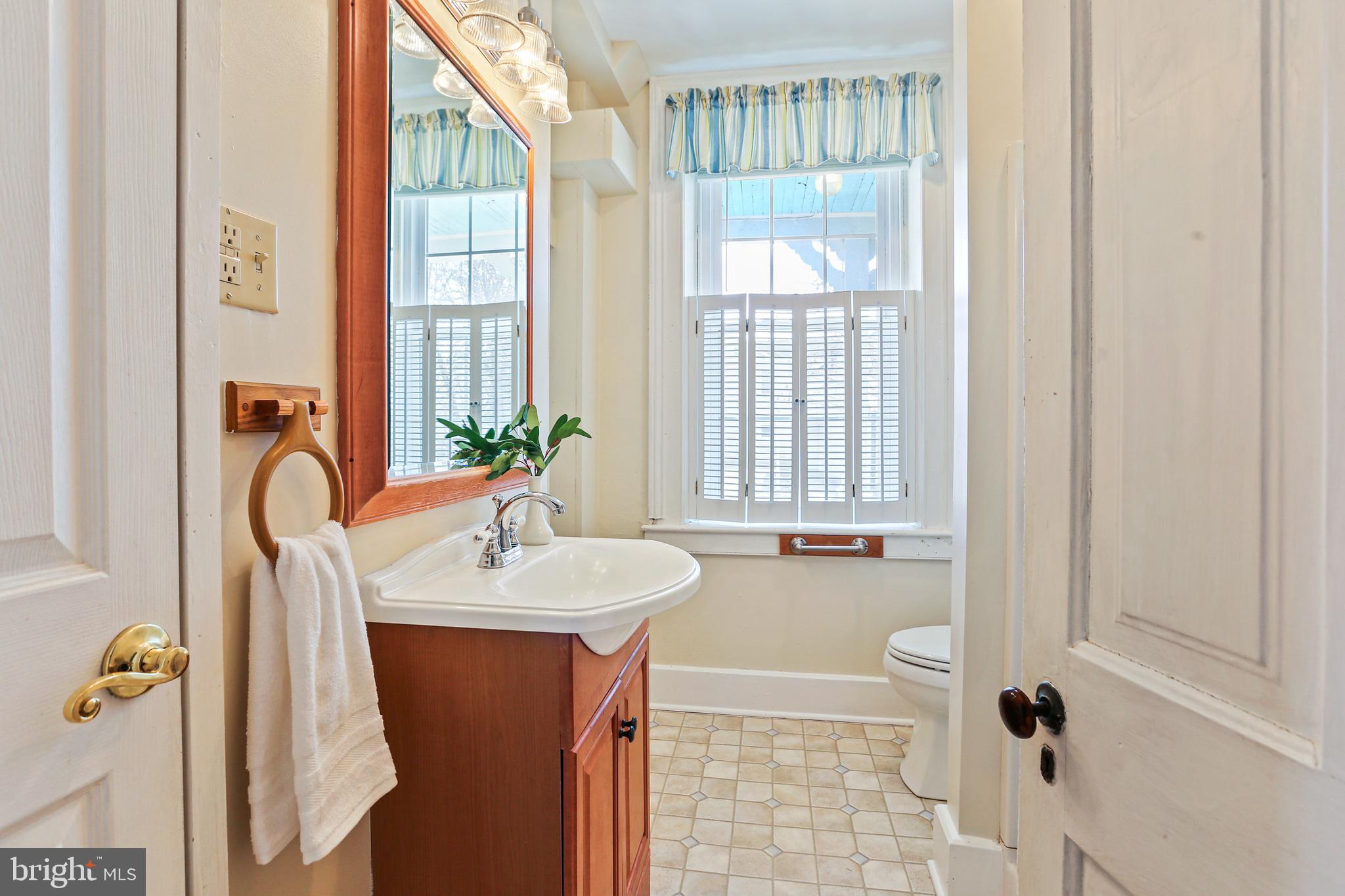 33 West Broadway Street Union Bridge, MD 21791 - Photo 10 of 31 a bathroom with a sink and a mirror