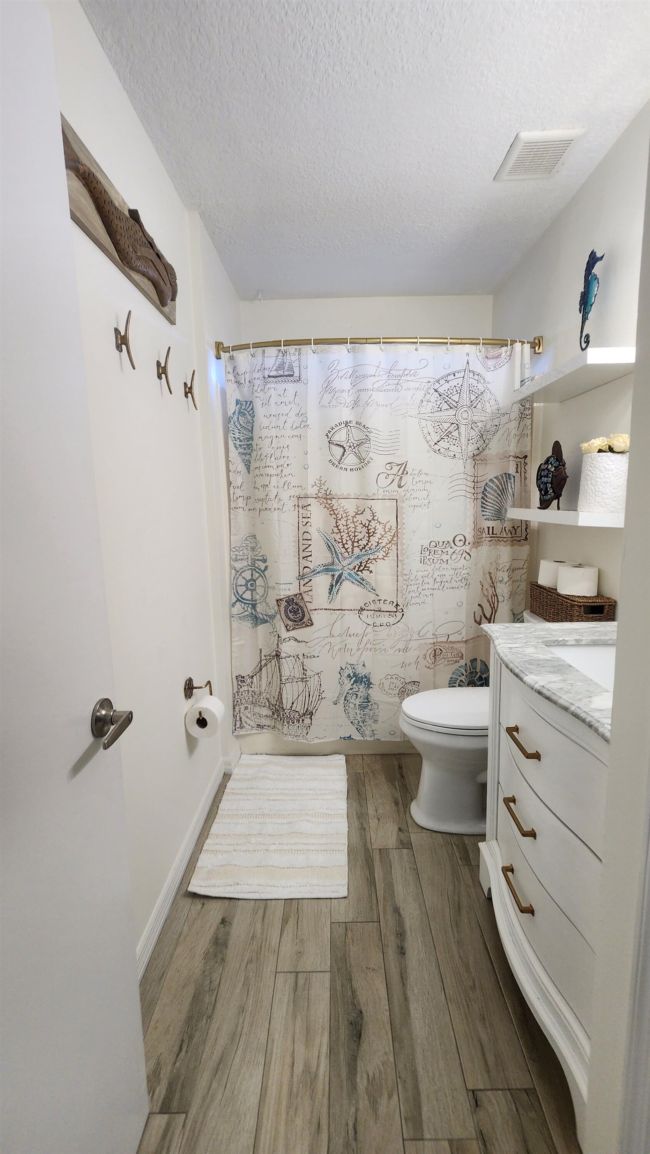 206 4th Street St. Augustine, FL 32080 - Photo 8 of 11 a bathroom with a sink a toilet and shower