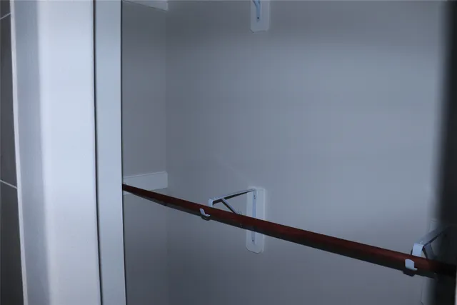 a kitchen with a sink appliances and cabinets