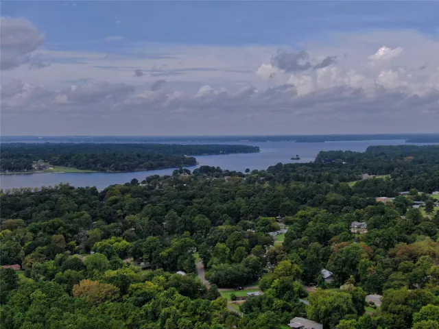 an aerial view of house with swimming pool outdoor seating and yard