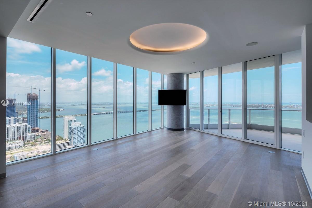 Edgewater Miami, FL 33137 - Photo 1 of 42 a view of an empty room with wooden floor and a fireplace