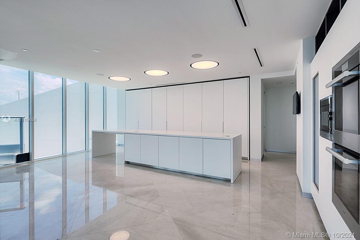 Edgewater Miami, FL 33137 - Photo 2 of 42 a view of an empty room with a kitchen