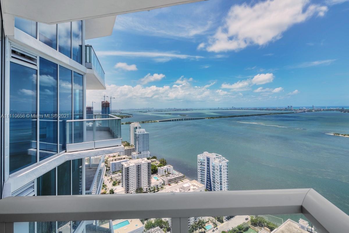 Edgewater Miami, FL 33137 - Photo 16 of 42 a front view of a house with lake view