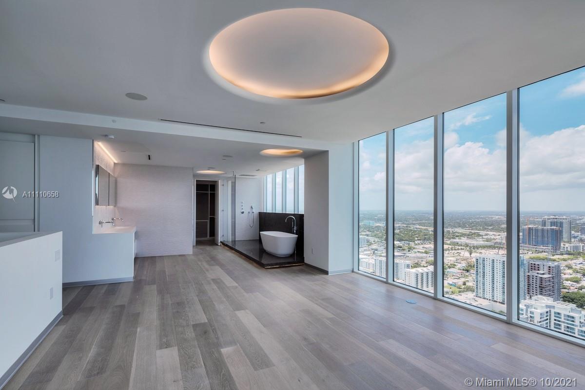 Edgewater Miami, FL 33137 - Photo 19 of 42 a view of a room with furniture and wooden floor