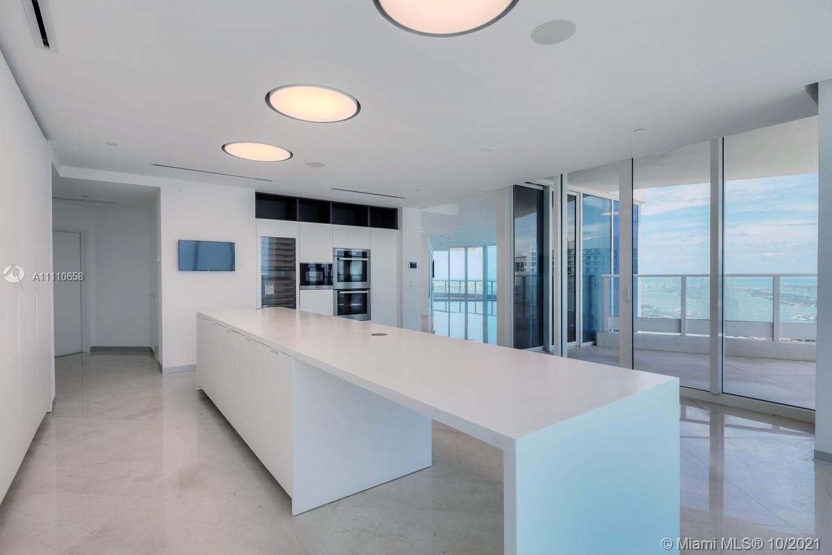 Edgewater Miami, FL 33137 - Photo 3 of 42 a large white kitchen with a large window