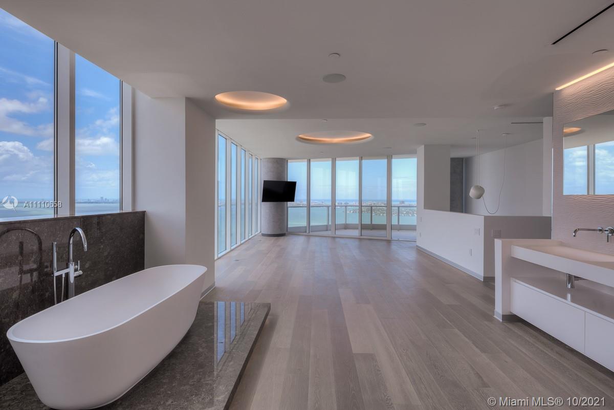 Edgewater Miami, FL 33137 - Photo 21 of 42 a living room with furniture and a large window