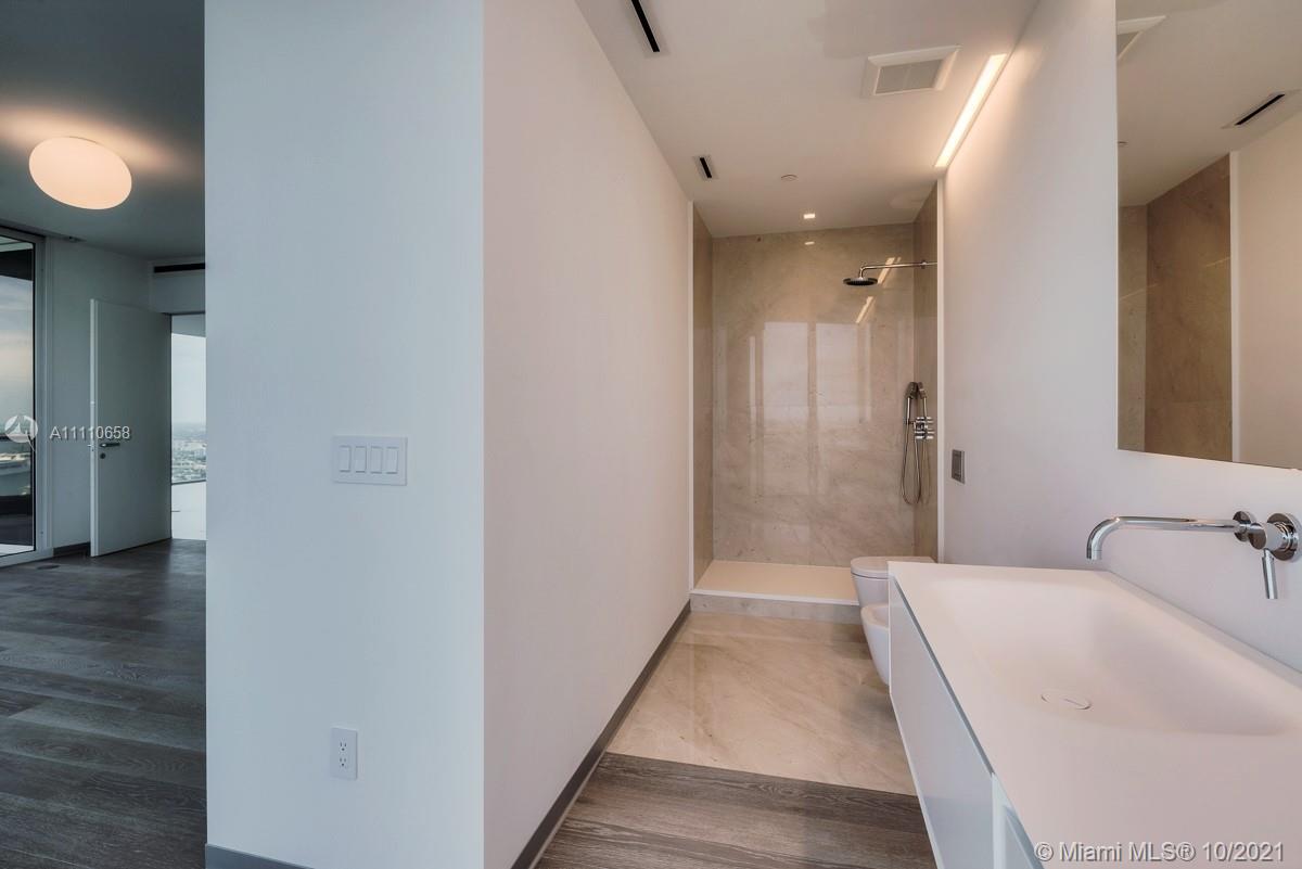 Edgewater Miami, FL 33137 - Photo 26 of 42 a bathroom with a sink and shower