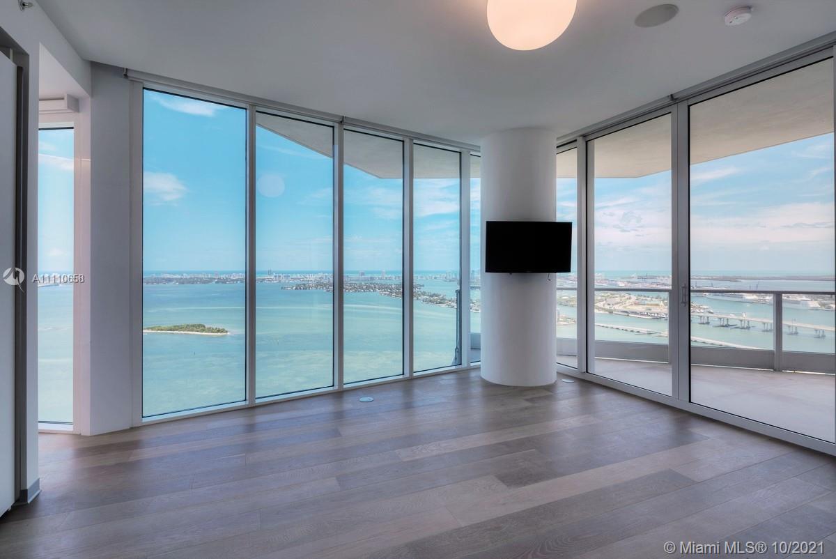 Edgewater Miami, FL 33137 - Photo 27 of 42 a view of an empty room with wooden floor and a window