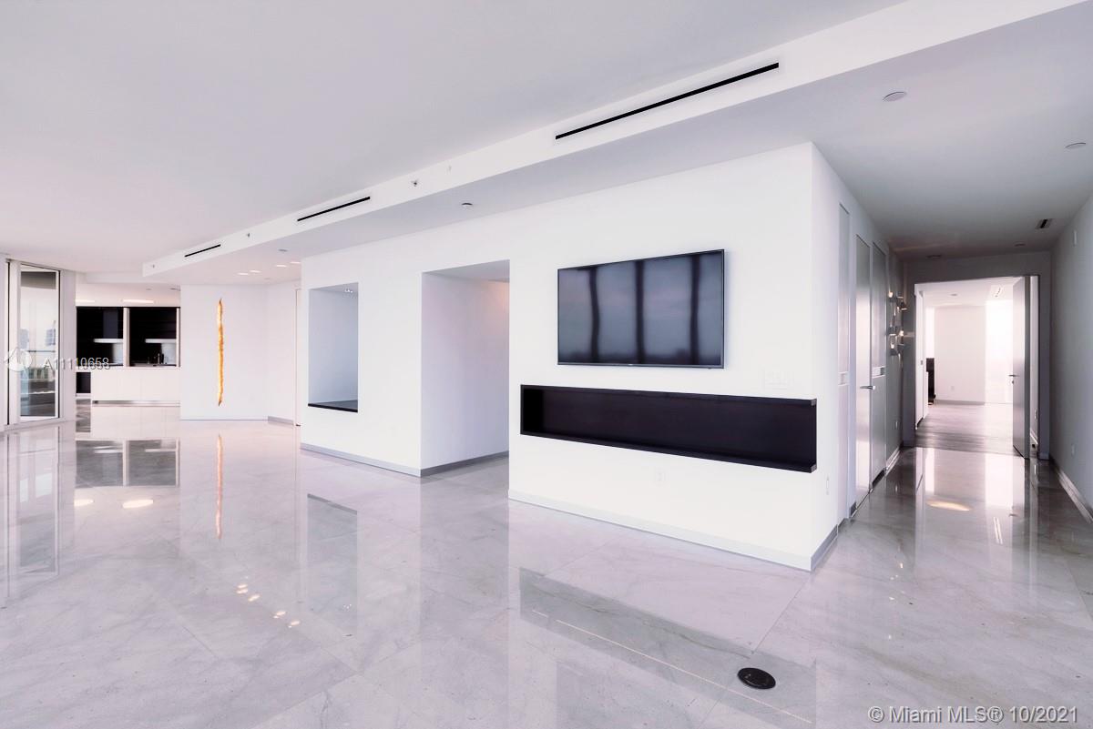 Edgewater Miami, FL 33137 - Photo 6 of 42 a living room with furniture and a flat screen tv