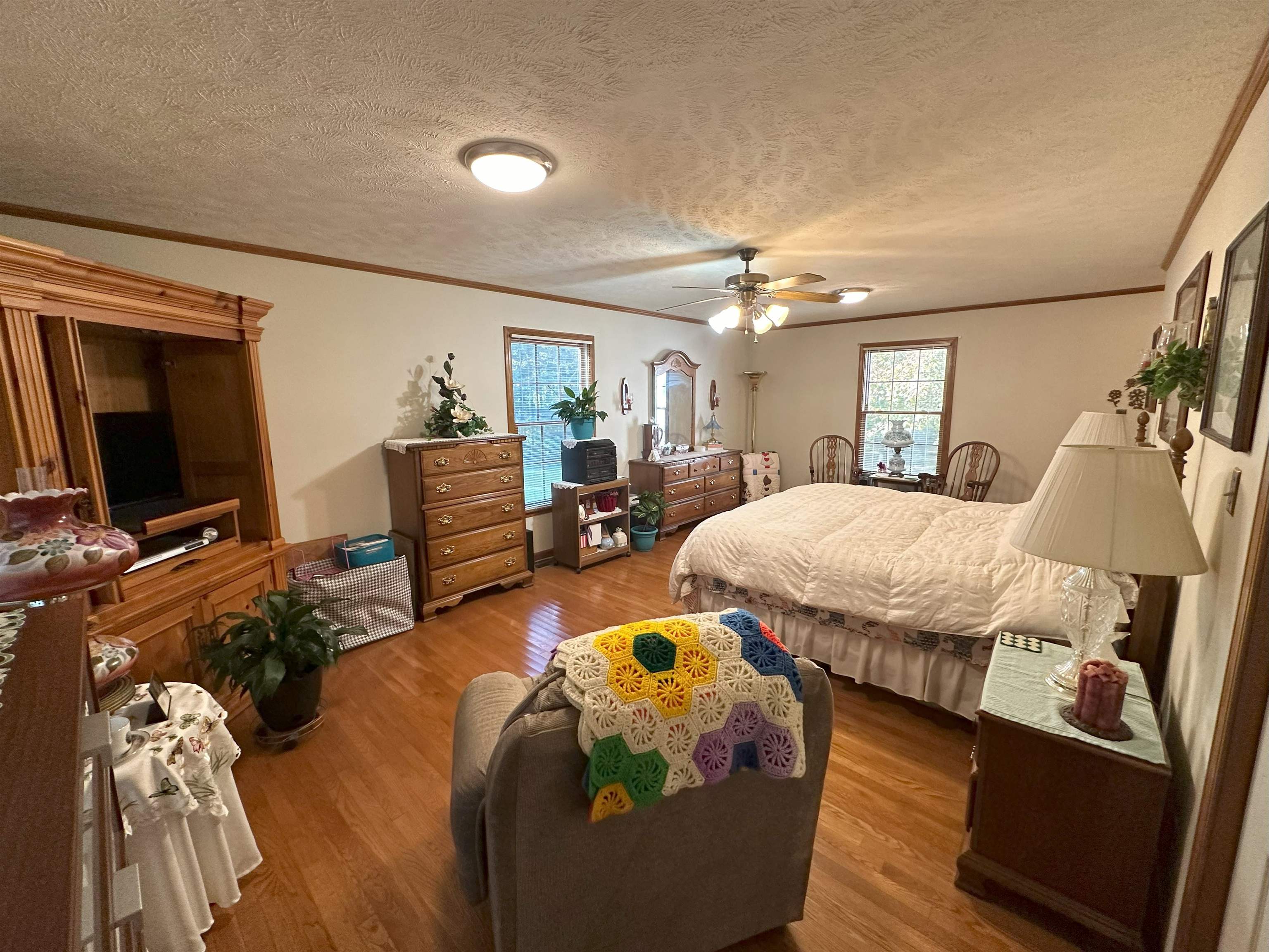 883 Crucifer Road Huron, TN 38345 - Photo 12 of 22 Bedroom with a textured ceiling, hardwood / wood-style flooring, and ceiling fan