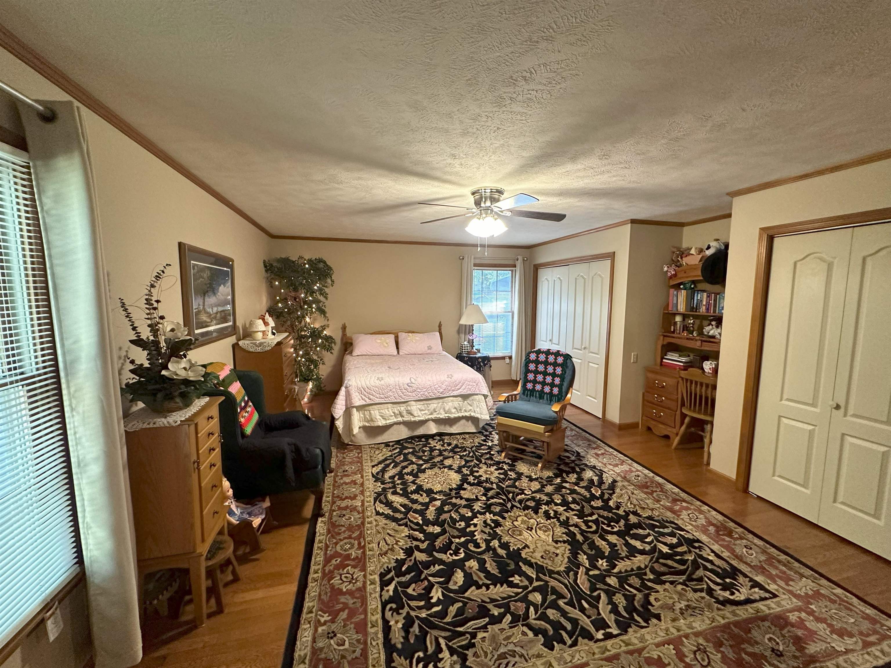 883 Crucifer Road Huron, TN 38345 - Photo 17 of 22 Bedroom with ornamental molding, a textured ceiling, hardwood / wood-style flooring, and ceiling fan
