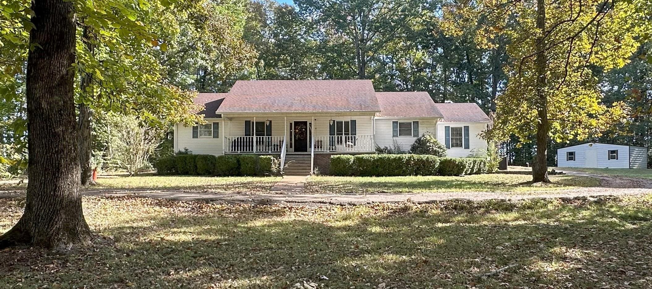 883 Crucifer Road Huron, TN 38345 - Photo 2 of 22 View of front of home with covered porch and a front lawn