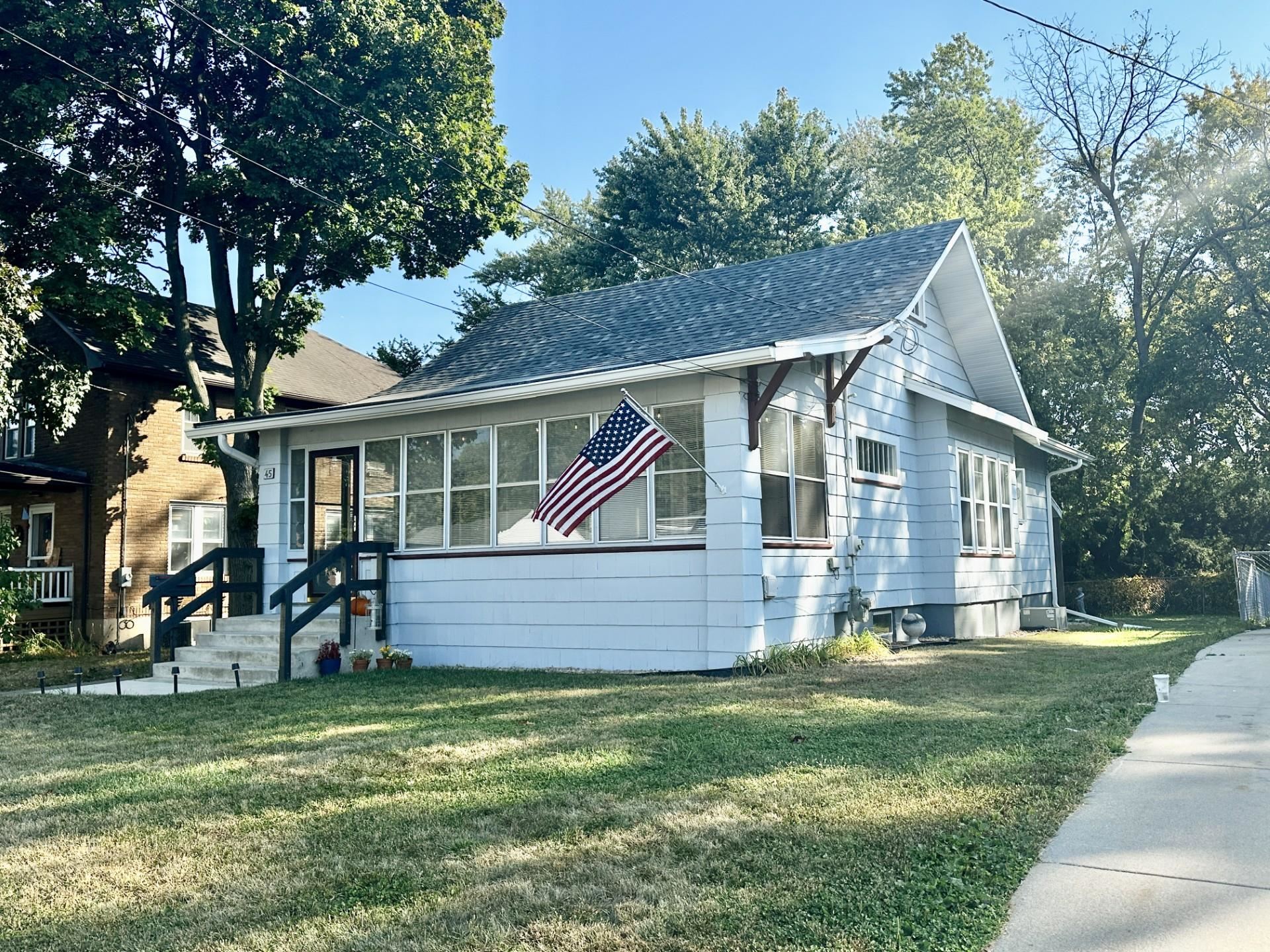 45 North Sunset Avenue Freeport, IL 61032 - Photo 1 of 23 a front view of a house with a yard