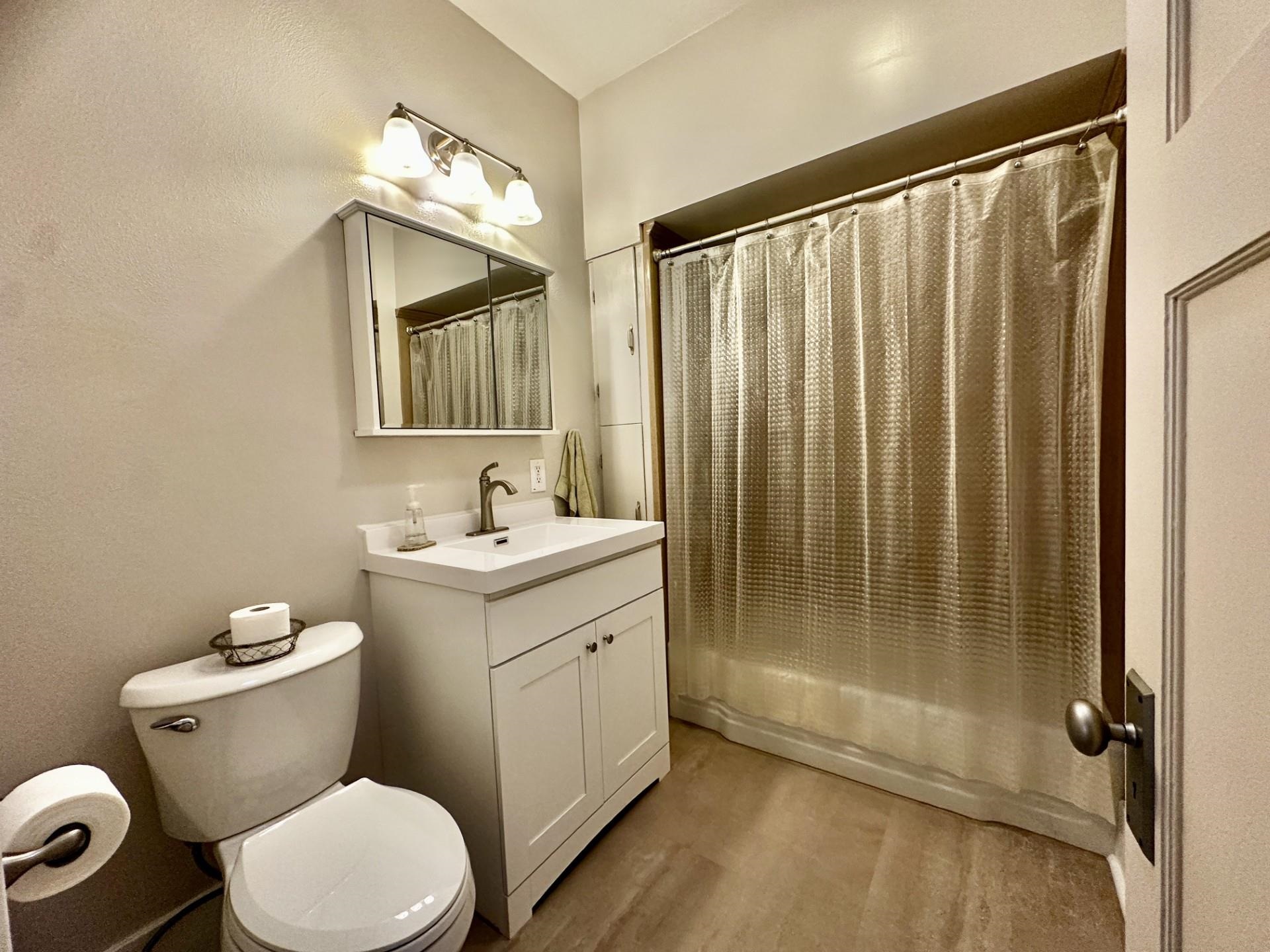 45 North Sunset Avenue Freeport, IL 61032 - Photo 13 of 23 a bathroom with a sink a toilet a mirror and shower