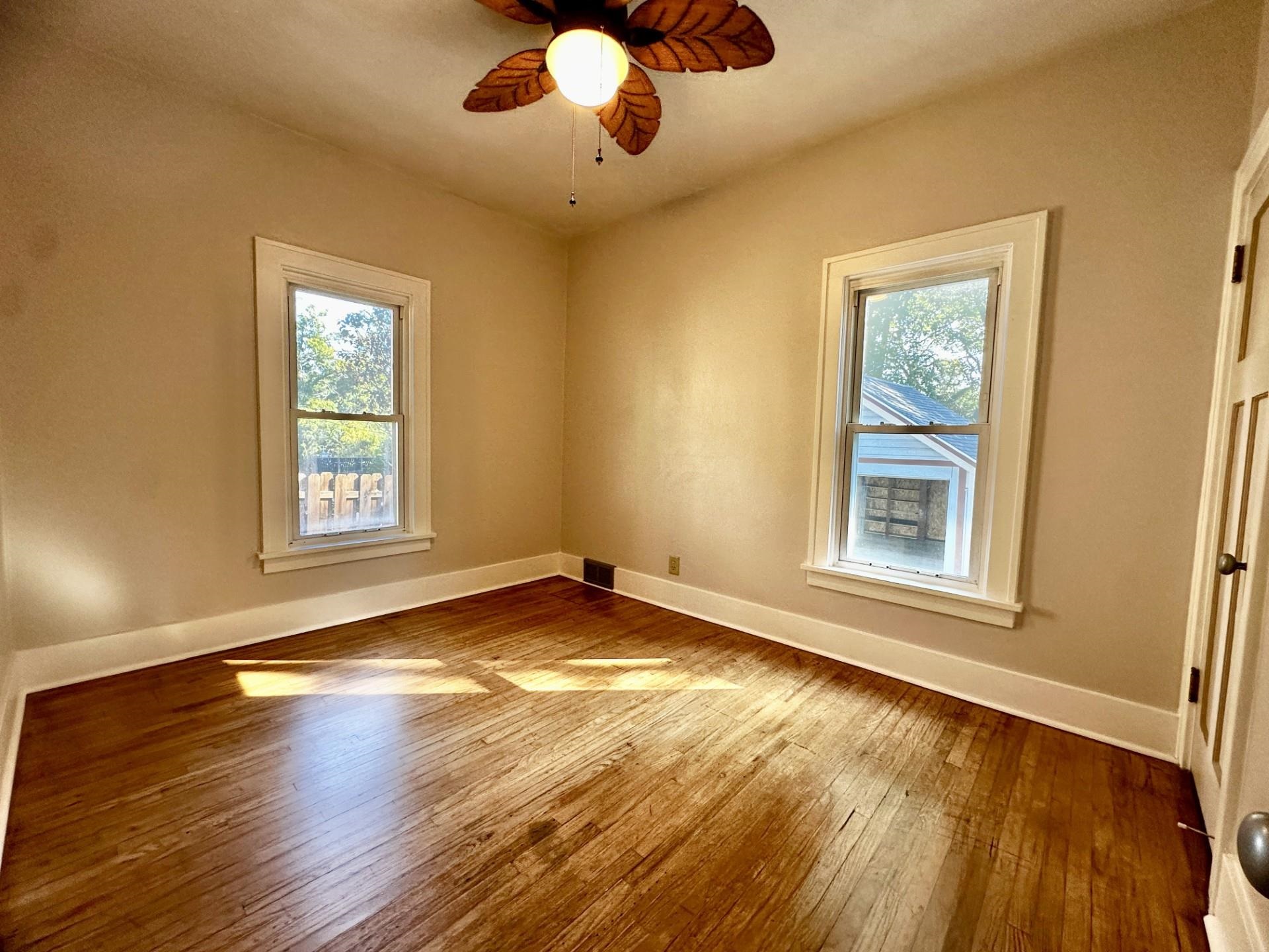 45 North Sunset Avenue Freeport, IL 61032 - Photo 14 of 23 a view of an empty room with window and wooden floor