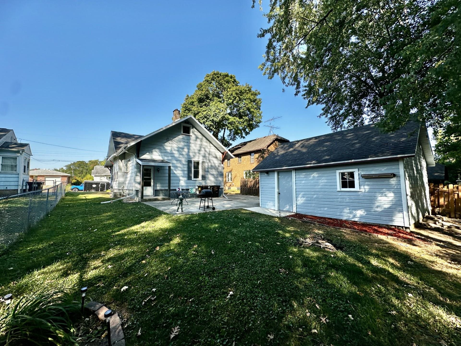 45 North Sunset Avenue Freeport, IL 61032 - Photo 22 of 23 a front view of a house with a yard