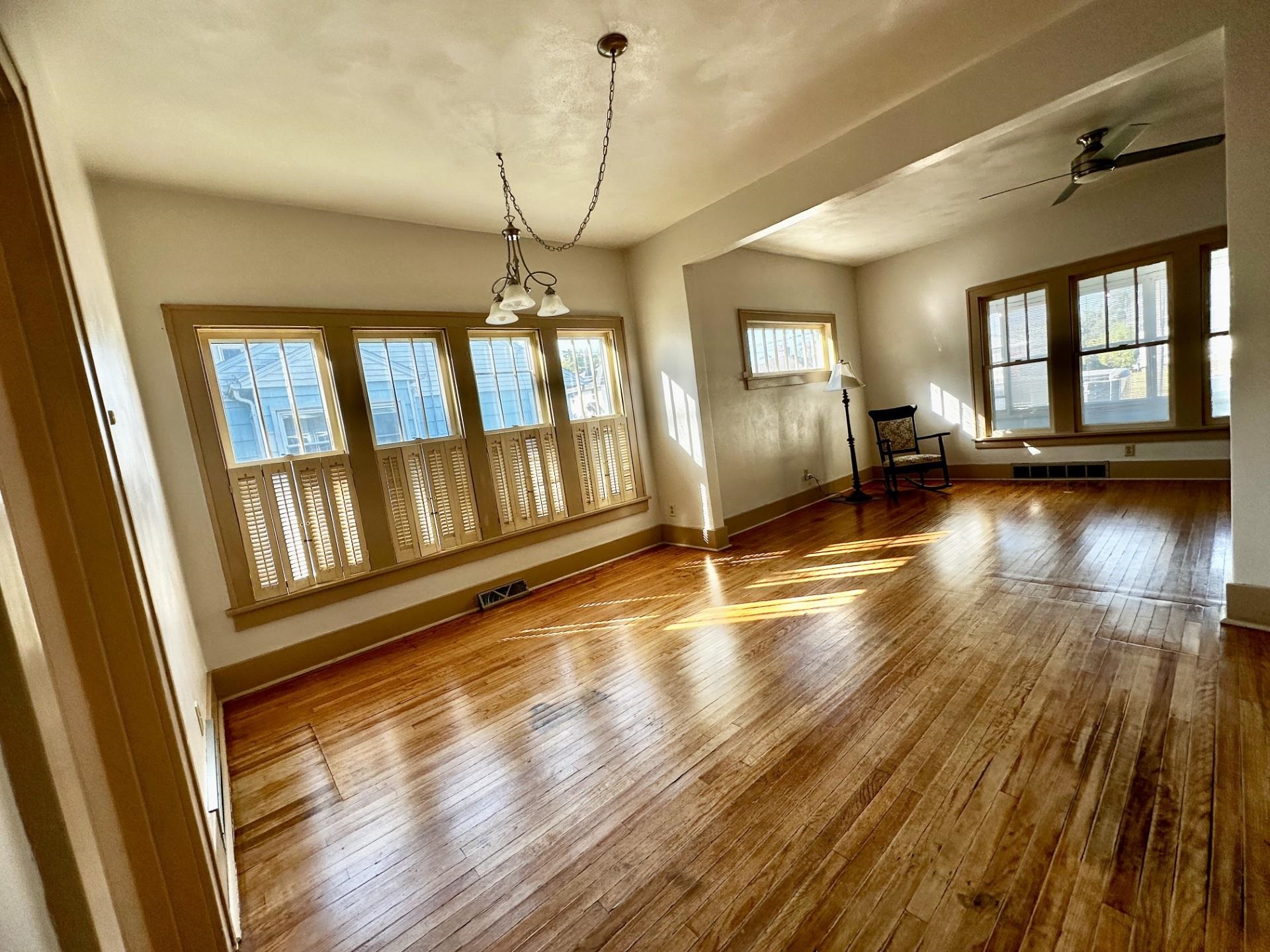 45 North Sunset Avenue Freeport, IL 61032 - Photo 5 of 23 a view of a room with wooden floor fireplace and windows