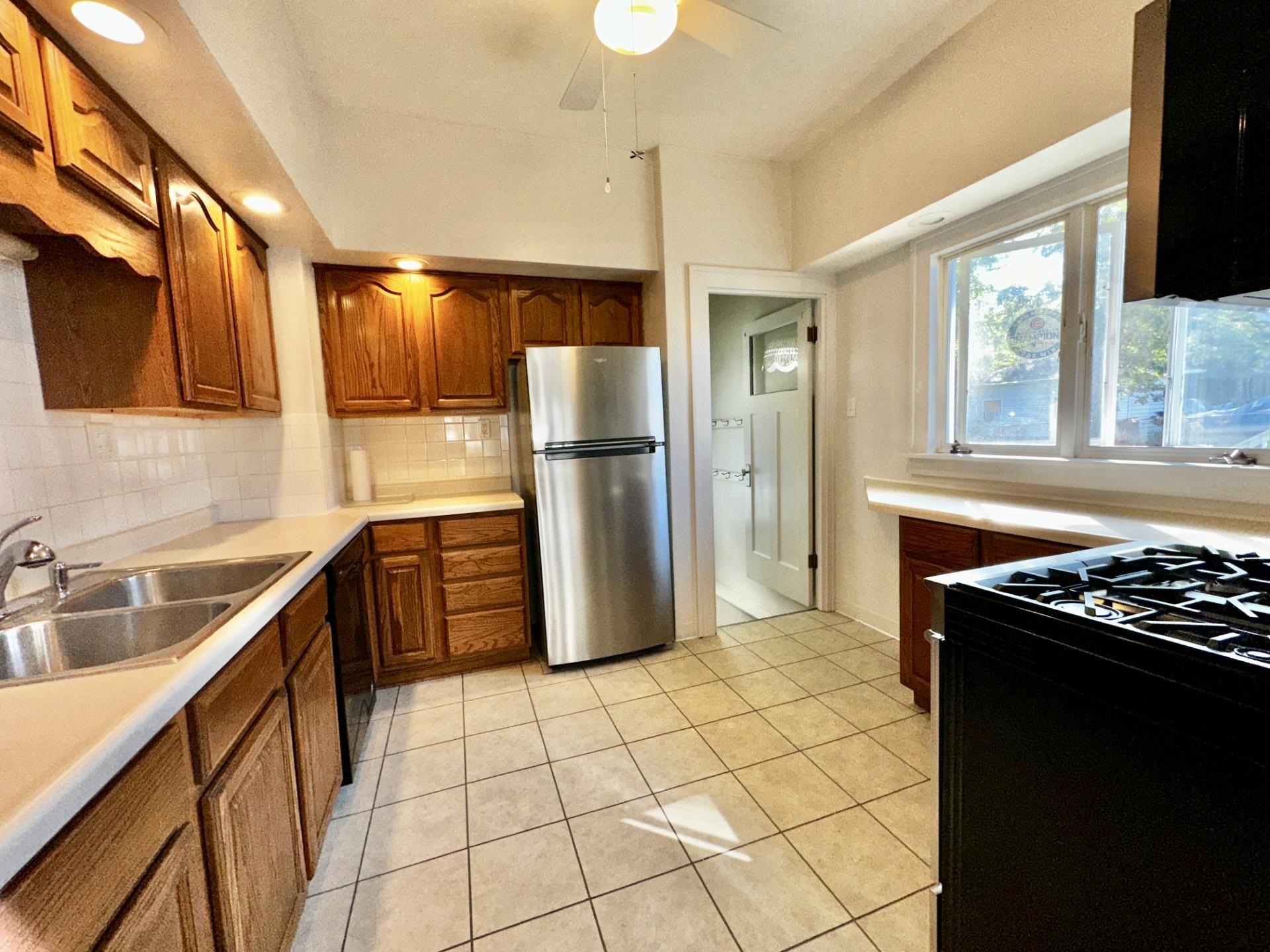 45 North Sunset Avenue Freeport, IL 61032 - Photo 7 of 23 a kitchen with a stove a refrigerator and a sink