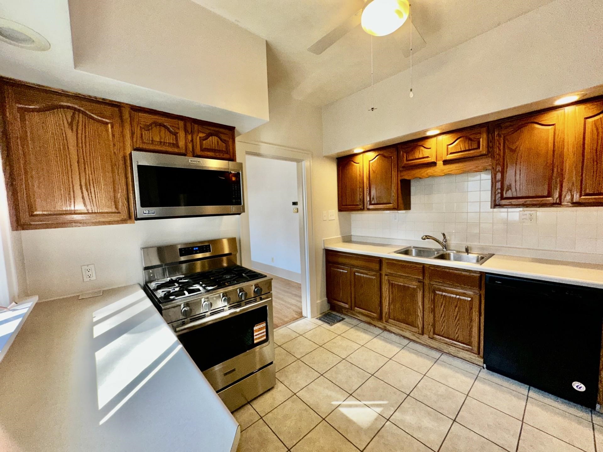 45 North Sunset Avenue Freeport, IL 61032 - Photo 8 of 23 a kitchen with a sink a stove and cabinets