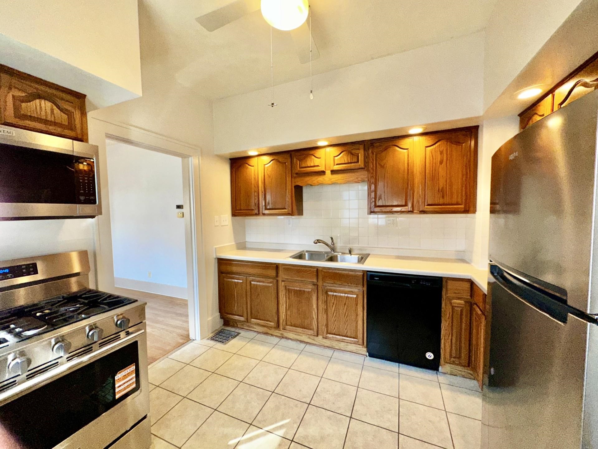 45 North Sunset Avenue Freeport, IL 61032 - Photo 10 of 23 a kitchen with stainless steel appliances granite countertop a stove a sink and a microwave