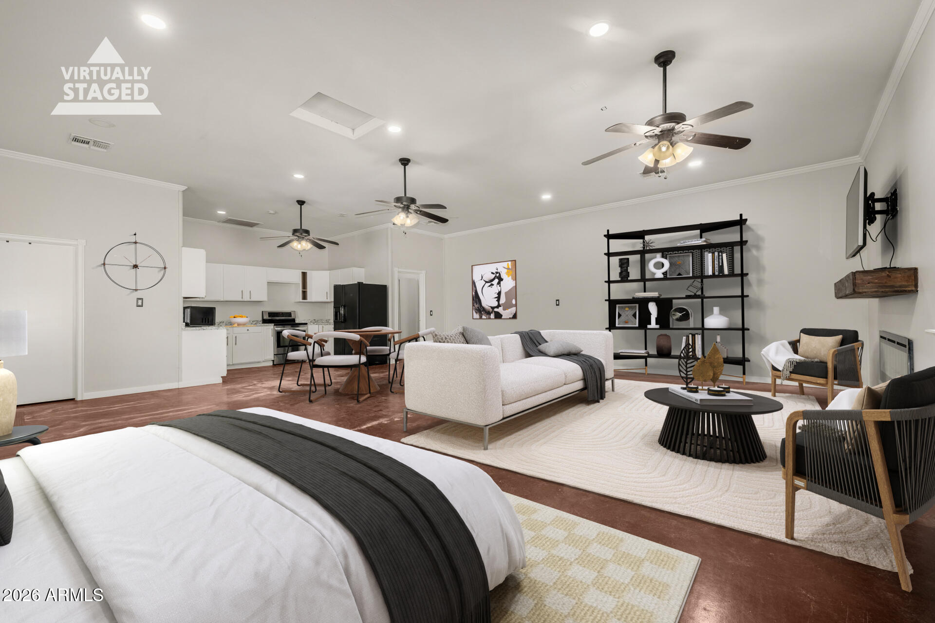 a bedroom with a bed a couch and chandelier