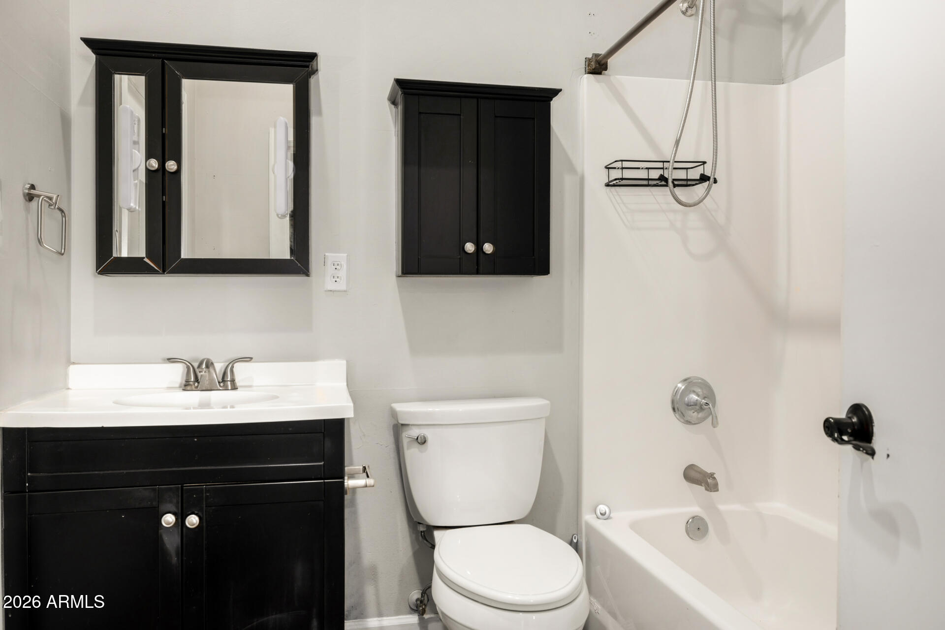 2266 East Willis Road Gilbert, AZ 85297 - Photo 11 of 15 a bathroom with a sink a toilet and a mirror