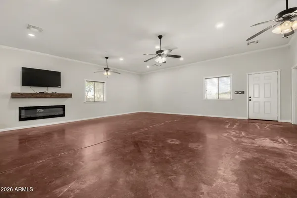 a view of livingroom with hardwood floor and a ceiling fan