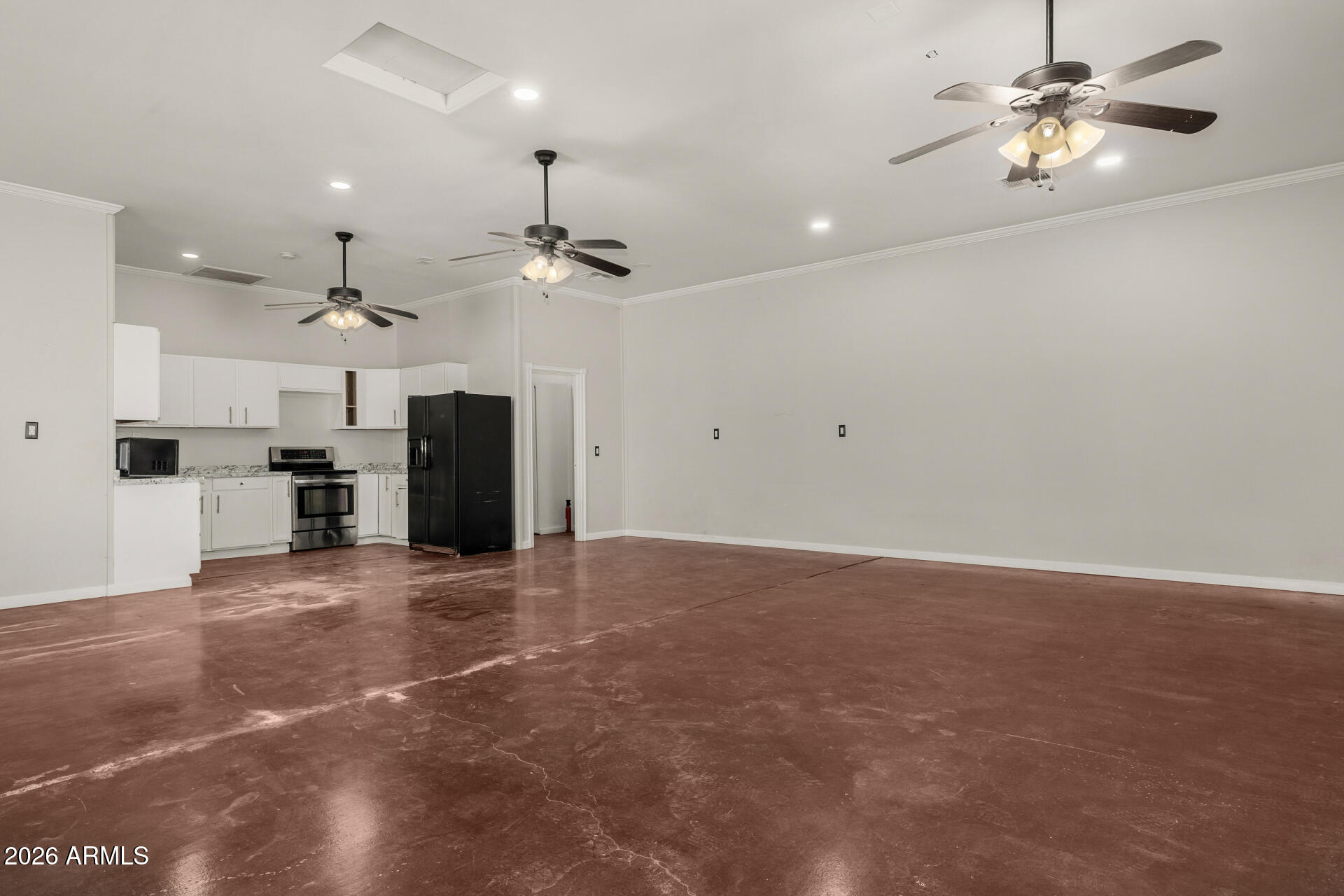 2266 East Willis Road Gilbert, AZ 85297 - Photo 8 of 15 an empty room with a ceiling fan and a window