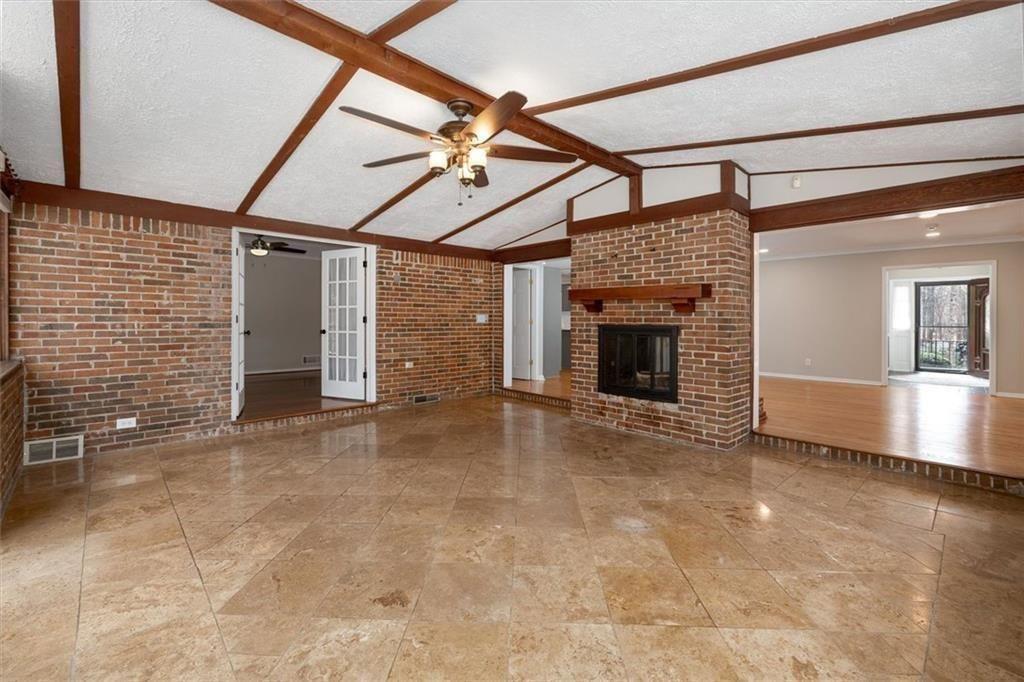 5498 Smoke Rise Drive Smoke Rise, GA 30087 - Photo 14 of 52 a view of empty room with fireplace