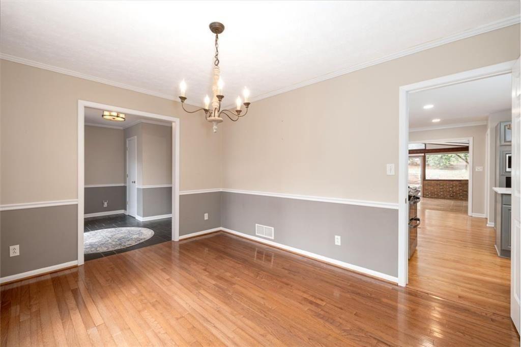 5498 Smoke Rise Drive Smoke Rise, GA 30087 - Photo 16 of 52 a view of empty room with wooden floor