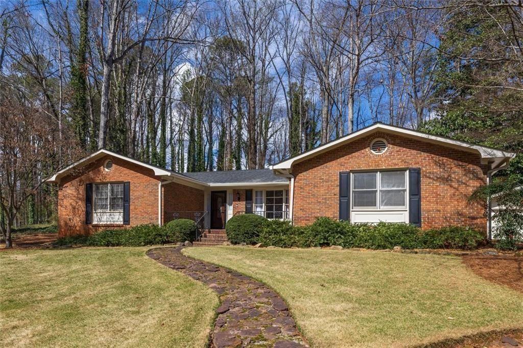 5498 Smoke Rise Drive Smoke Rise, GA 30087 - Photo 2 of 52 a front view of a house with a yard