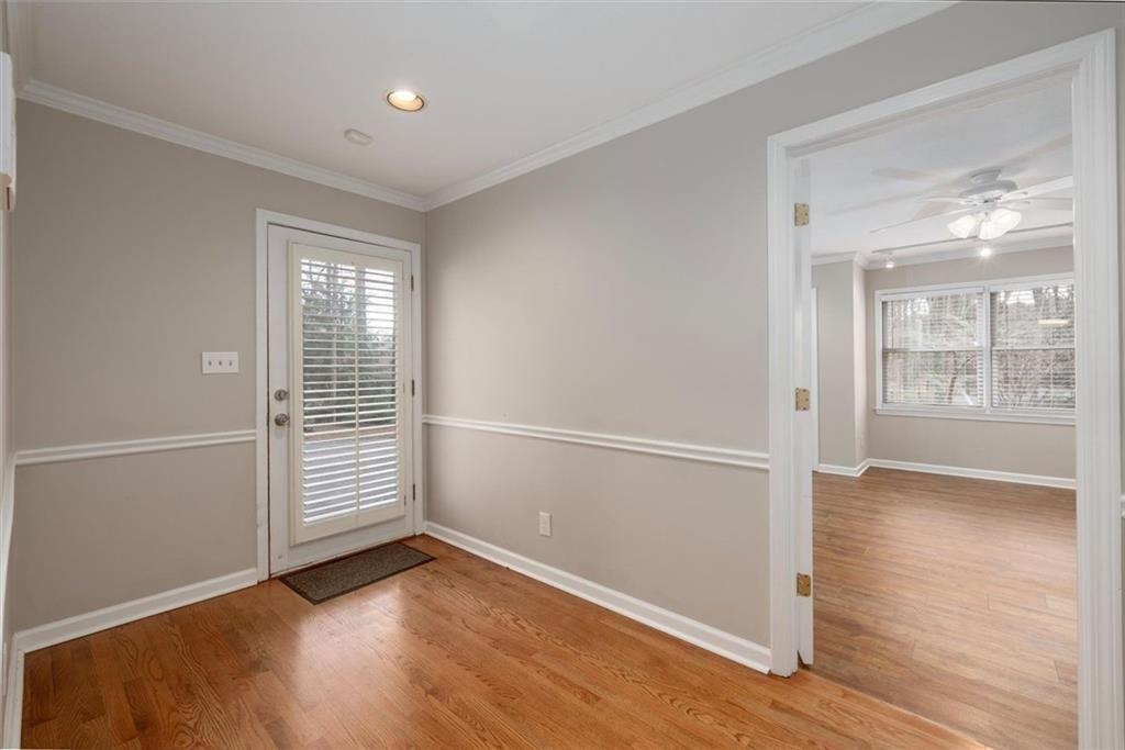 5498 Smoke Rise Drive Smoke Rise, GA 30087 - Photo 22 of 52 an empty room with wooden floor and windows