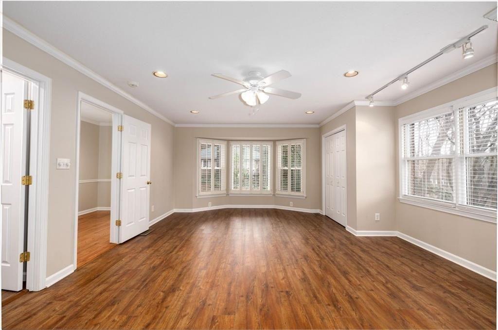 5498 Smoke Rise Drive Smoke Rise, GA 30087 - Photo 24 of 52 a view of an empty room with wooden floor and a window