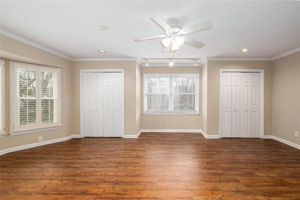 5498 Smoke Rise Drive Smoke Rise, GA 30087 - Photo 26 of 52 a view of an empty room with wooden floor and a window