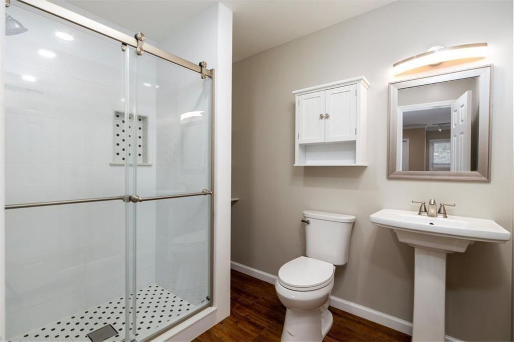 5498 Smoke Rise Drive Smoke Rise, GA 30087 - Photo 27 of 52 a bathroom with a sink toilet and shower