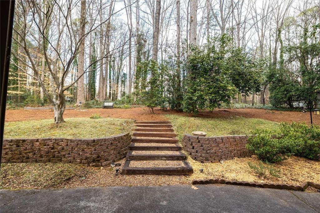 5498 Smoke Rise Drive Smoke Rise, GA 30087 - Photo 35 of 52 a view of a yard with tree s