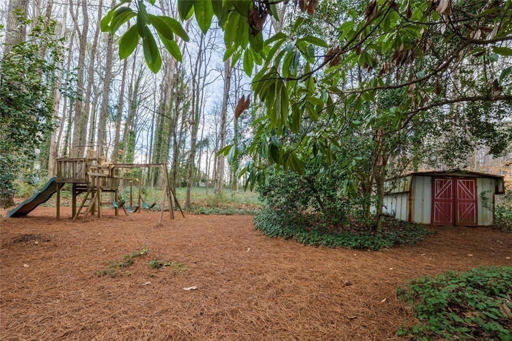 5498 Smoke Rise Drive Smoke Rise, GA 30087 - Photo 39 of 52 a view of a yard with a house