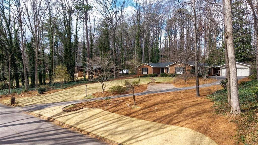 5498 Smoke Rise Drive Smoke Rise, GA 30087 - Photo 46 of 52 a view of a yard with trees