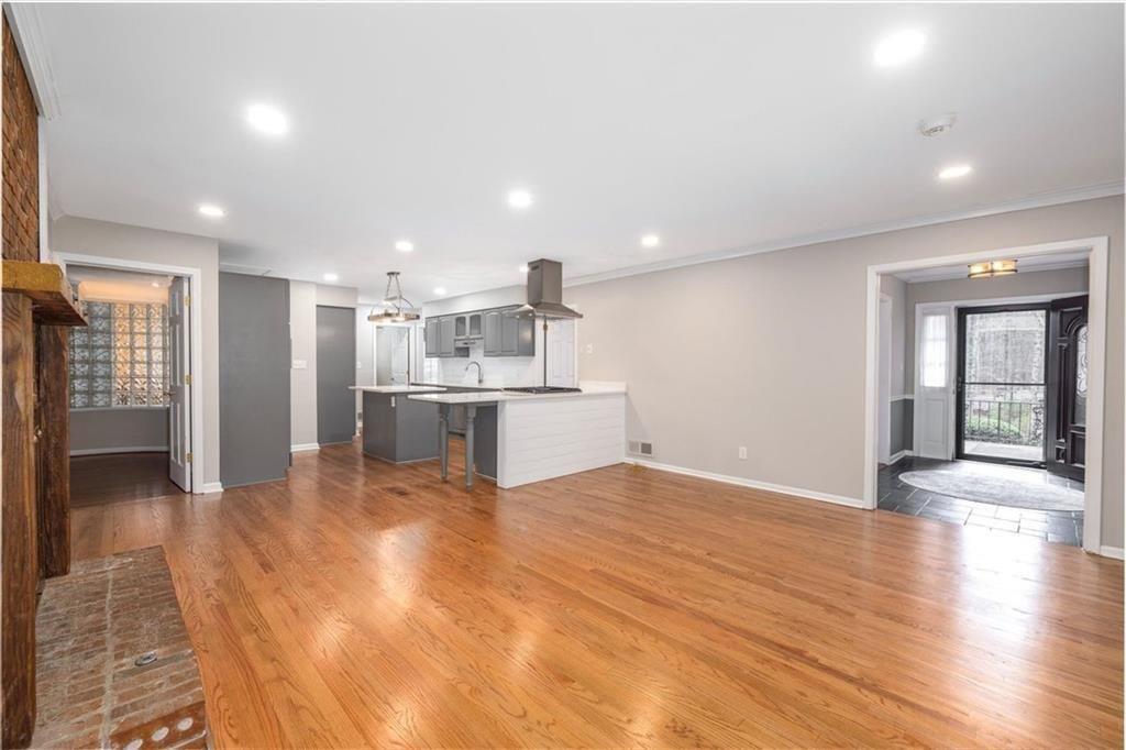 5498 Smoke Rise Drive Smoke Rise, GA 30087 - Photo 9 of 52 a view of kitchen with refrigerator stove and wooden floor